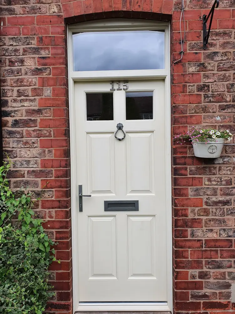 Panelled front door with glazed fanlight