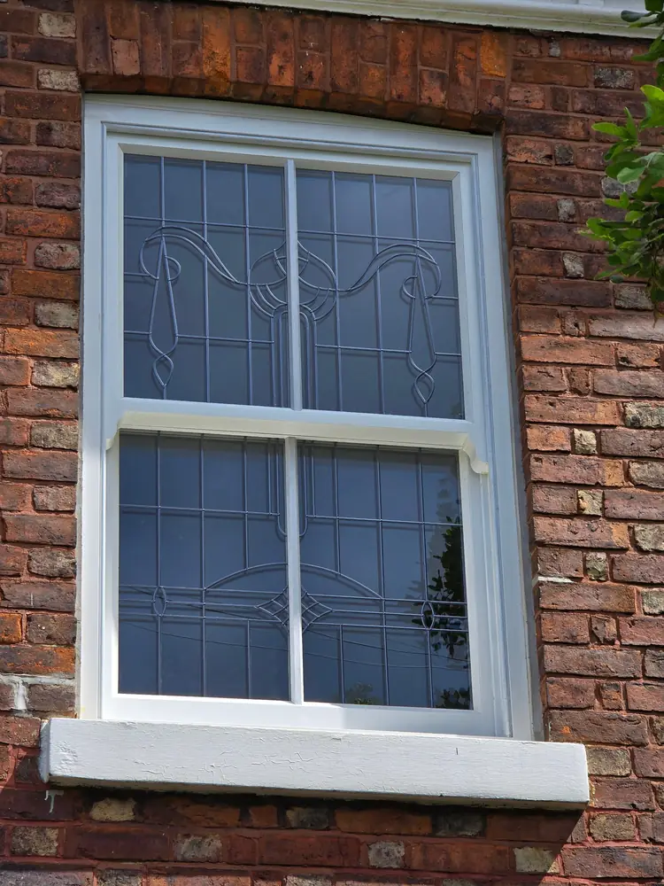 Sliding sash window with leaded glazing